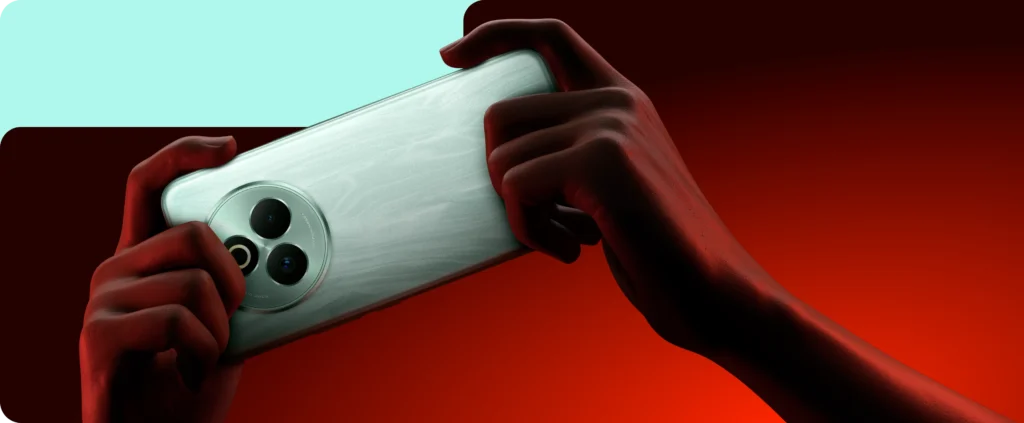 Hands holding a greenish‑silver smartphone horizontally, highlighting its circular triple‑rear camera module and textured back surface, as presented in the official product imagery.