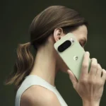 Google Pixel 10 Pro XL in green color held by a person, showing sleek rear camera design