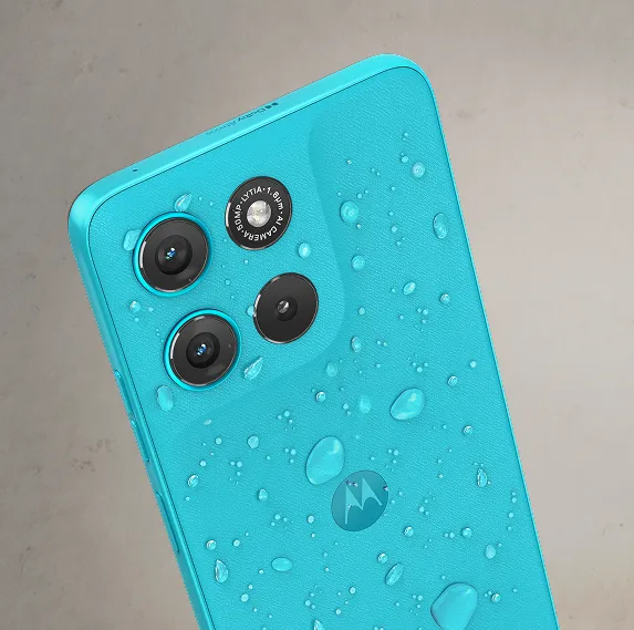 moto g67 power 5g price in india - Close-up of the aqua Motorola smartphone's back covered in water droplets, emphasizing its water resistance and dual camera setup.